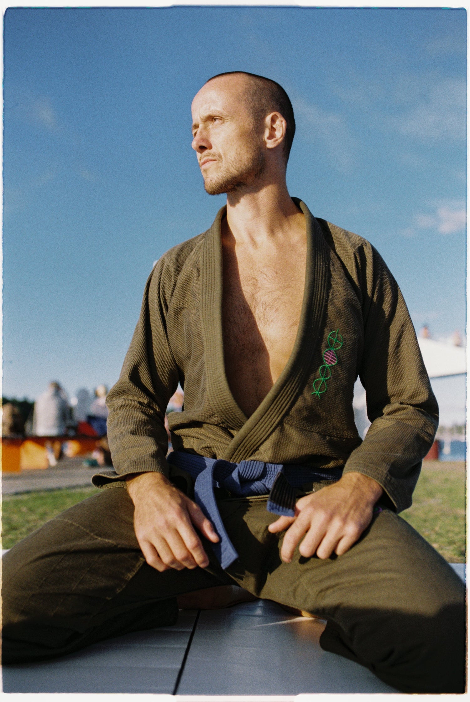 Three woman wearing black, blue and gray kimonos