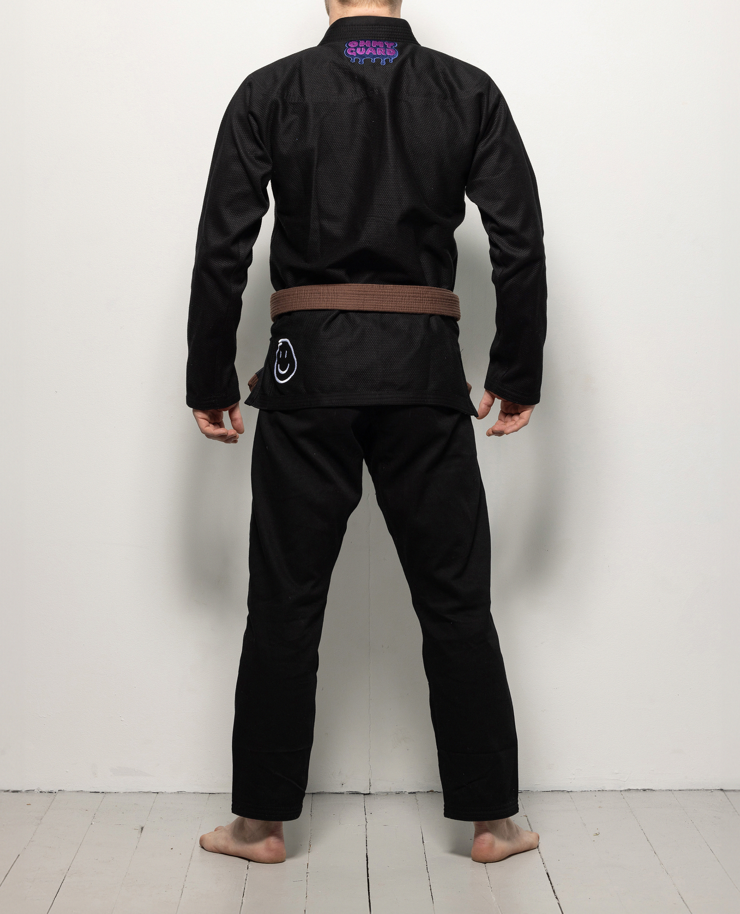 Back view of man wearing black kimono