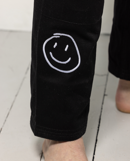 Close up of smiley detail on gi pant leg