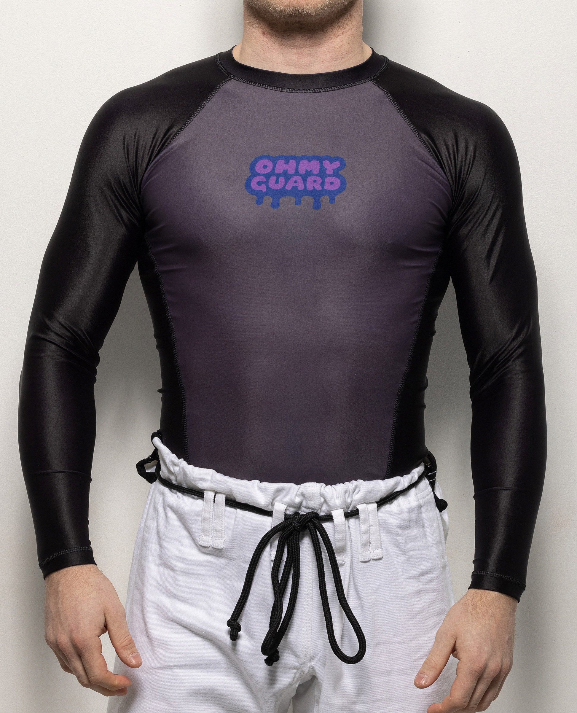 Front view of man in black and gray rashguard